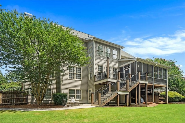 4653 Glory Maple Trce, Powder Springs, GA 30127 - rear view of property featuring a sunroom, a patio area, and stairway