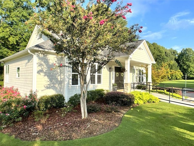 4653 Glory Maple Trce, Powder Springs, GA 30127 - view of front of property with a front yard, a porch, and roof with shingles