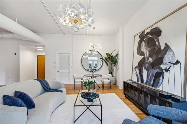 1058 Piedmont Ave Unit 103, Atlanta, GA 30309 - living room with a chandelier and light wood-style floors
