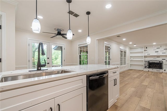 kitchen featuring white cabinetry, french doors, hanging light fixtures, and stainless steel dishwasher