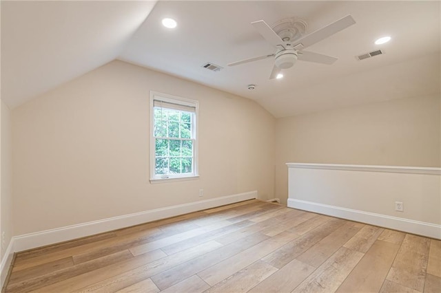 bonus room with light hardwood / wood-style floors, ceiling fan, and vaulted ceiling