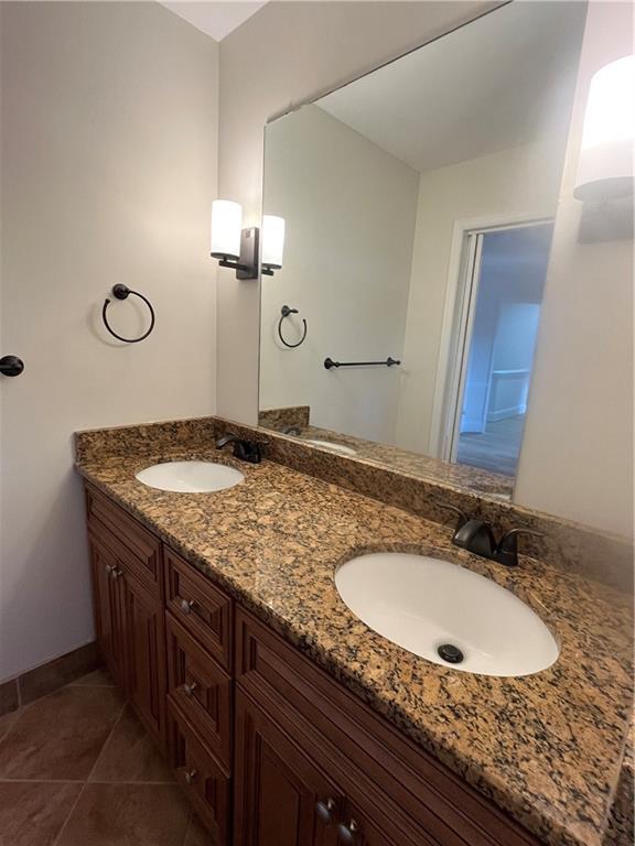 bathroom featuring vanity and tile patterned flooring