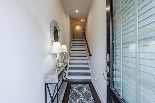 stairway with hardwood / wood-style flooring