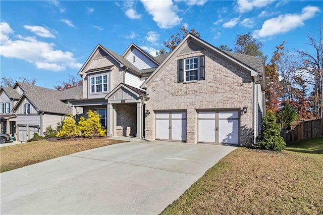 view of front of house with a garage and a front lawn