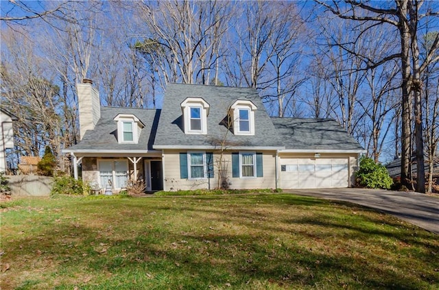 cape cod-style house featuring a chimney, driveway, a front lawn, and a garage