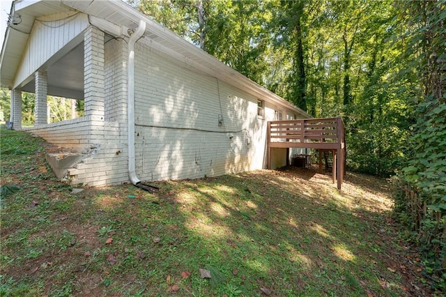 view of home's exterior featuring a wooden deck