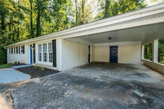 exterior space featuring a carport