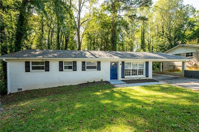 ranch-style house with a carport and a front lawn