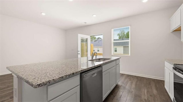 kitchen with white cabinets, sink, an island with sink, and stainless steel appliances