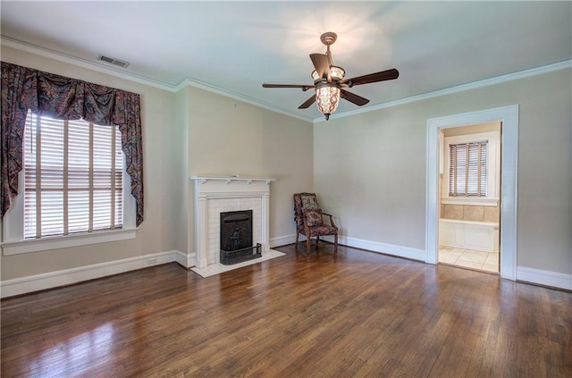 unfurnished living room featuring dark hardwood / wood-style flooring, ornamental molding, and ceiling fan