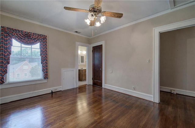 unfurnished bedroom with dark wood-type flooring, ceiling fan, ornamental molding, and connected bathroom