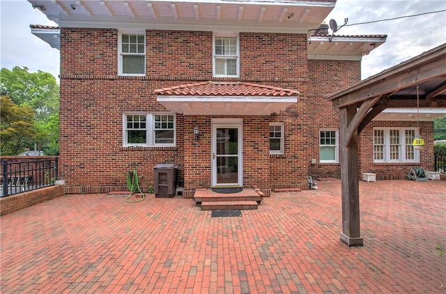 rear view of property featuring a patio area