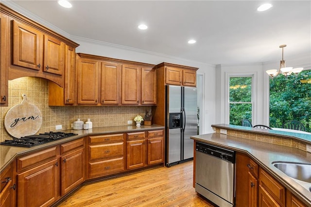 5355 Highland Pine Ln, Mableton, GA 30126 - kitchen featuring stainless steel appliances, brown cabinets, crown molding, decorative backsplash, and recessed lighting