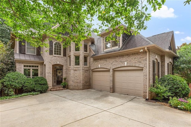5355 Highland Pine Ln, Mableton, GA 30126 - view of front of house featuring driveway, brick siding, a shingled roof, and a garage