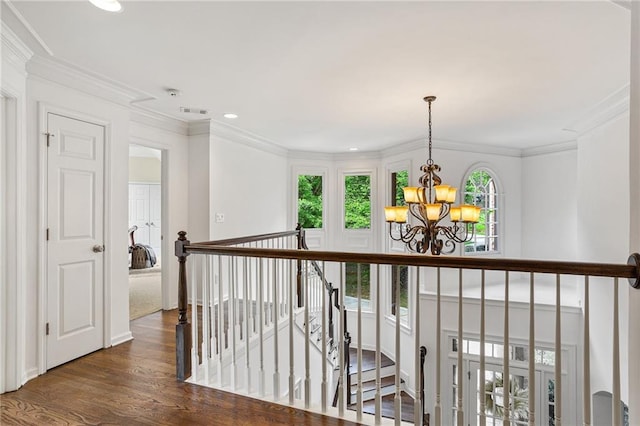5355 Highland Pine Ln, Mableton, GA 30126 - hall featuring a chandelier, an upstairs landing, dark wood-style floors, recessed lighting, and crown molding