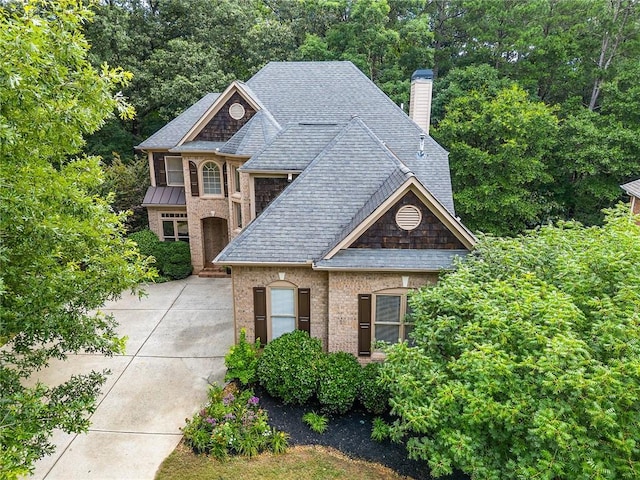 5355 Highland Pine Ln, Mableton, GA 30126 - french provincial home with a chimney, a shingled roof, and brick siding