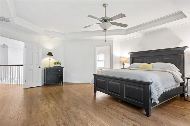5355 Highland Pine Ln, Mableton, GA 30126 - bedroom featuring a raised ceiling, ornamental molding, wood finished floors, and ceiling fan