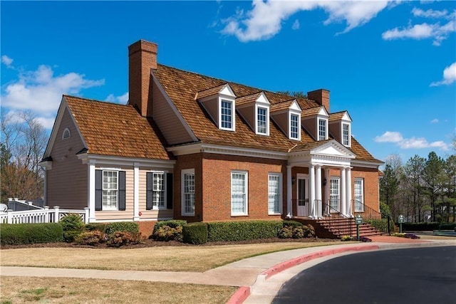 5355 Highland Pine Ln, Mableton, GA 30126 - new england style home with a chimney and brick siding