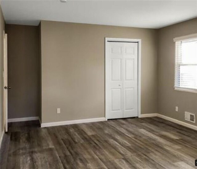 2900 Bradmoor Ct, Decatur, GA 30034 - unfurnished bedroom with baseboards, visible vents, and wood finished floors