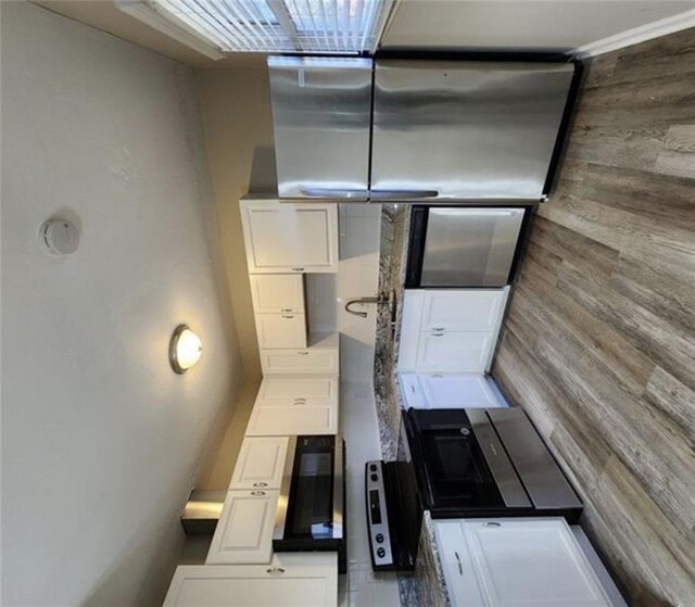 kitchen featuring white cabinetry