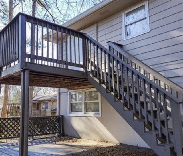 view of side of home with a wooden deck