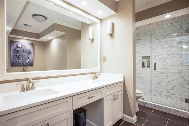 bathroom featuring vanity, toilet, ornamental molding, and walk in shower