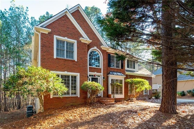 view of front of house featuring brick siding