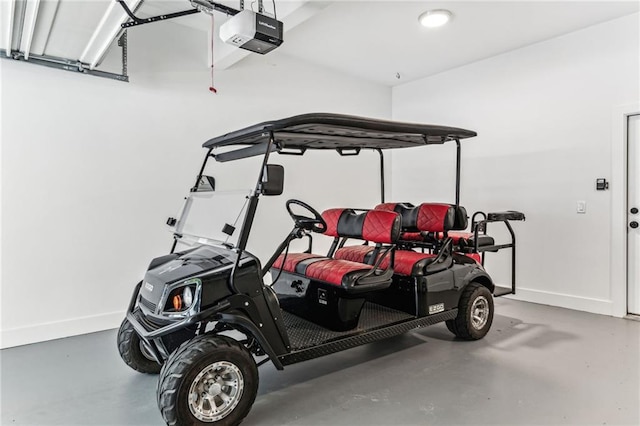 garage featuring baseboards and a garage door opener