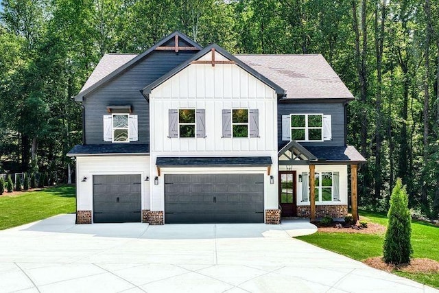 modern inspired farmhouse with driveway, a front lawn, a garage, board and batten siding, and brick siding