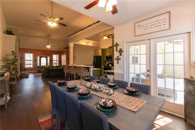 dining area featuring french doors, lofted ceiling, and hardwood / wood-style floors