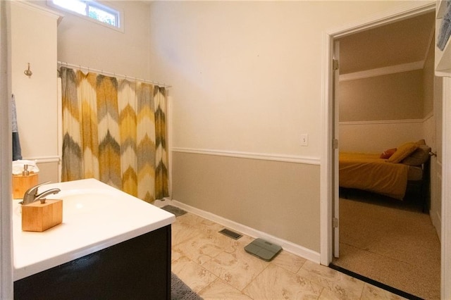 bathroom with tile patterned flooring and vanity