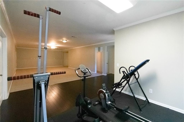 exercise room featuring ornamental molding and wood-type flooring