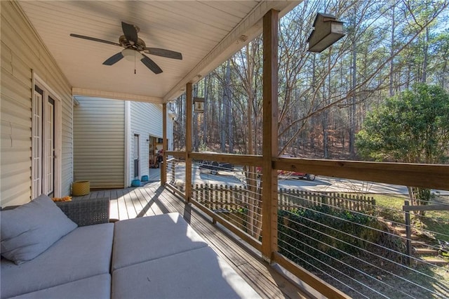 sunroom featuring ceiling fan