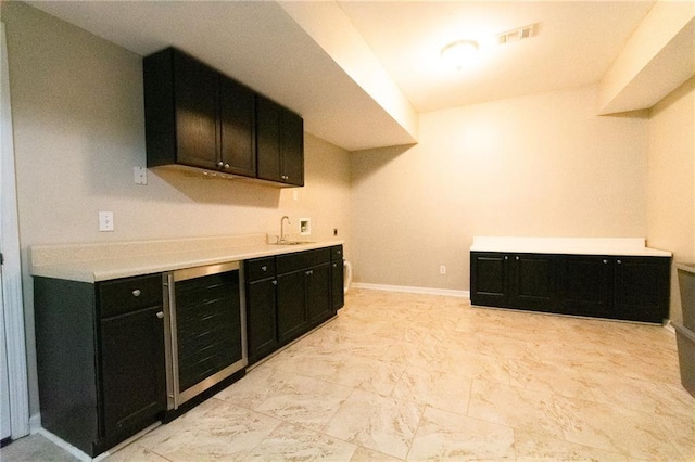 kitchen with sink and beverage cooler