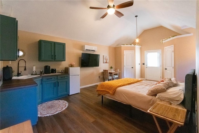 bedroom with a wall unit AC, sink, vaulted ceiling, white fridge, and dark hardwood / wood-style floors