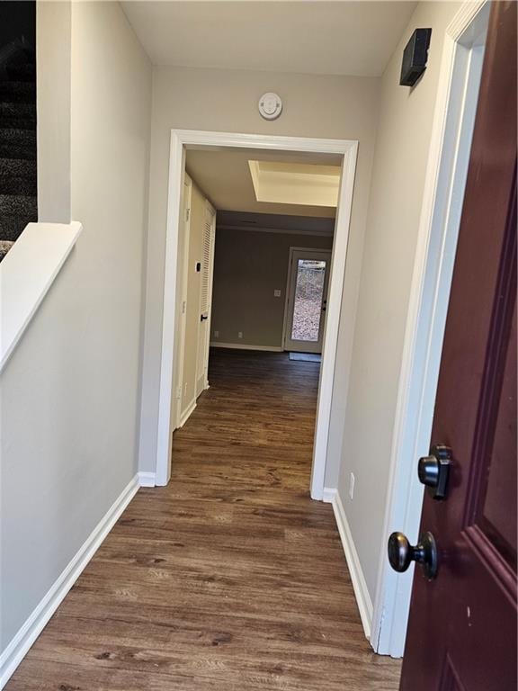 hallway with dark hardwood / wood-style floors