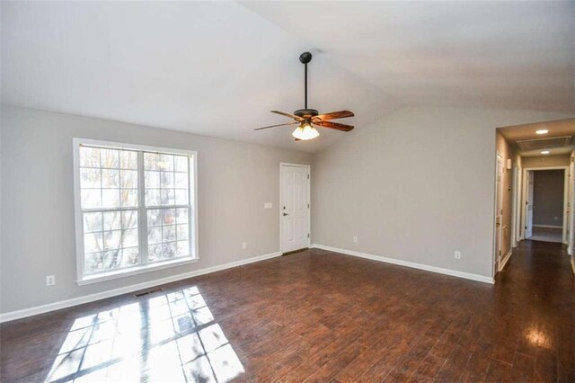 empty room with ceiling fan and dark hardwood / wood-style floors