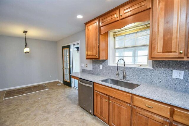 kitchen with decorative light fixtures, decorative backsplash, light stone countertops, and stainless steel appliances