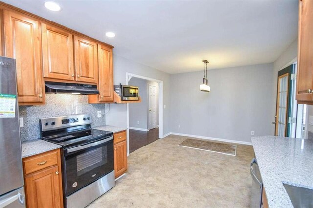 kitchen featuring decorative backsplash and appliances with stainless steel finishes