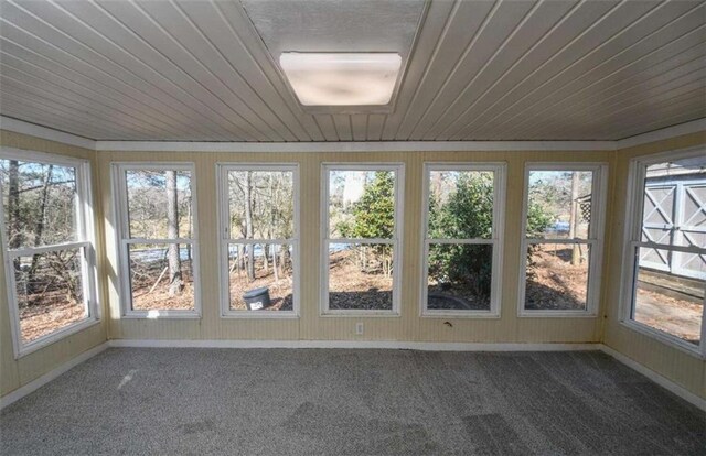 unfurnished sunroom with wood ceiling