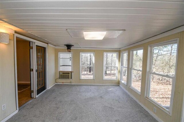 empty room featuring carpet and french doors