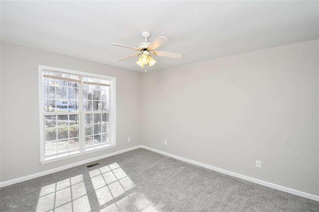 unfurnished bedroom with ceiling fan, a closet, and carpet flooring