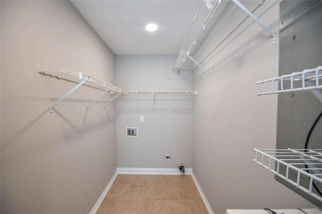 washroom featuring washer hookup and light tile patterned floors