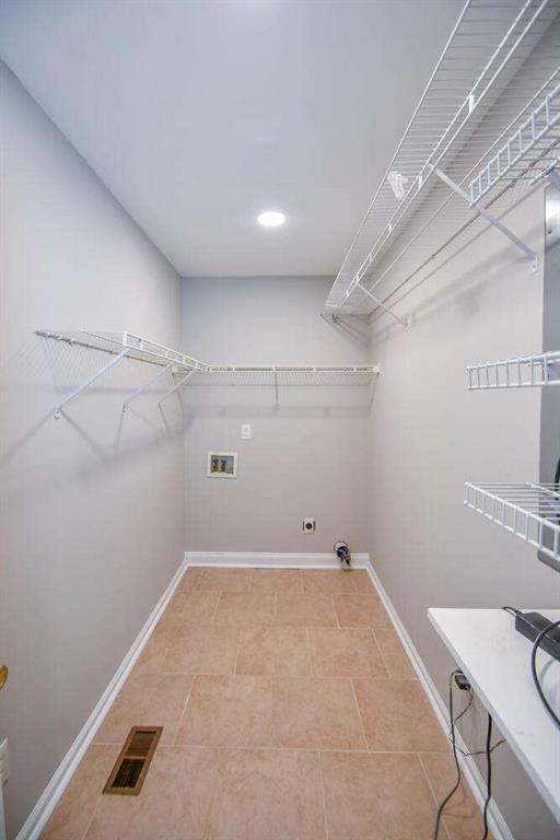 full bathroom with toilet, vanity, tile patterned flooring, and tub / shower combination