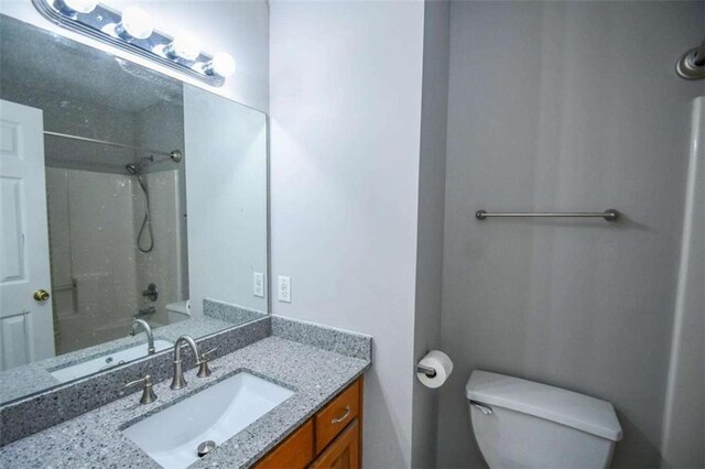 full bathroom featuring toilet, vanity, shower / washtub combination, and tile patterned flooring