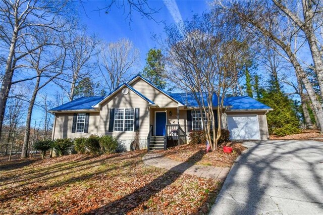 ranch-style home with a garage