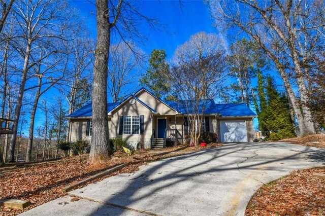 ranch-style house featuring a garage