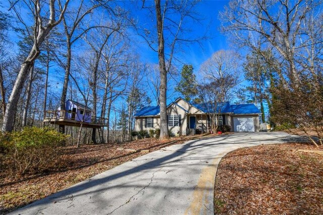 ranch-style home featuring a garage