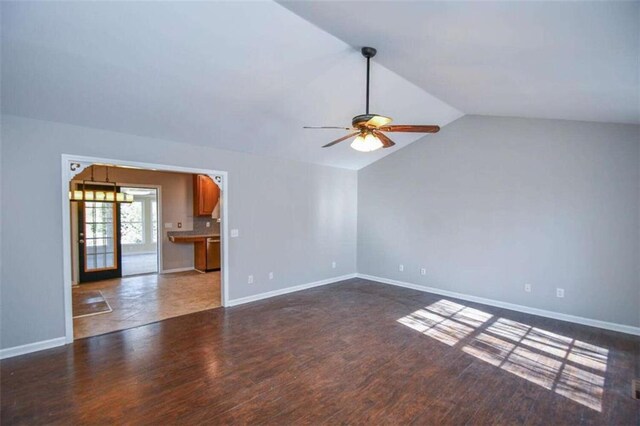 unfurnished room with ceiling fan, dark wood-type flooring, and french doors