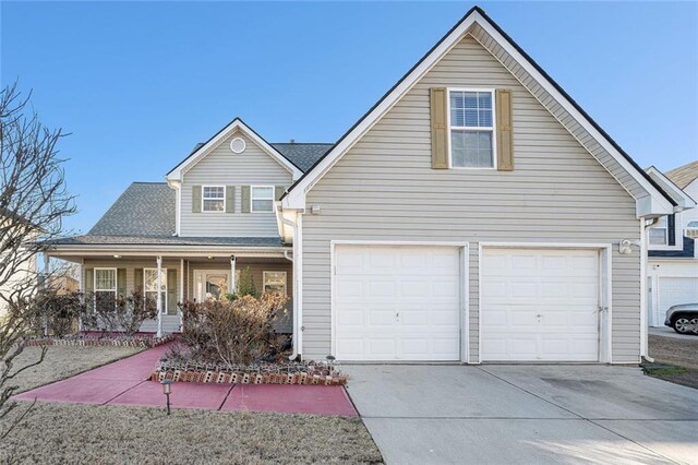 front facade with a porch and a garage